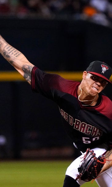 Escobar homers late, Arizona tops Dodgers in a wild one